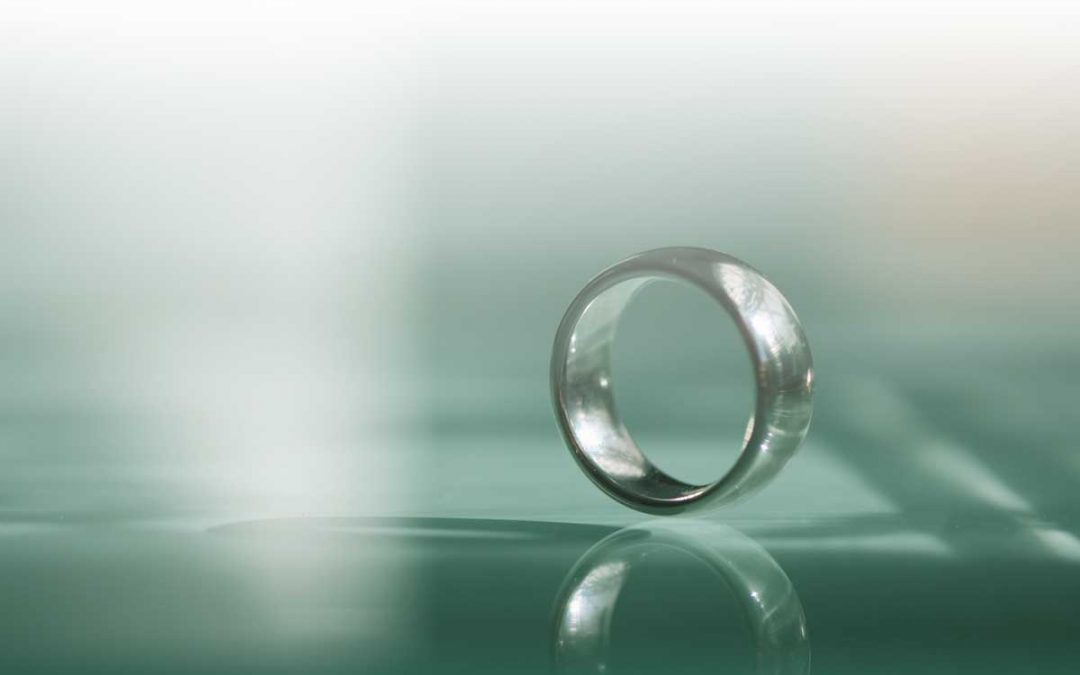wedding ring on its side, reflected - image - Pixabay